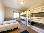 Lower level 4th bedroom: queen bed and 2 triple twin bunks